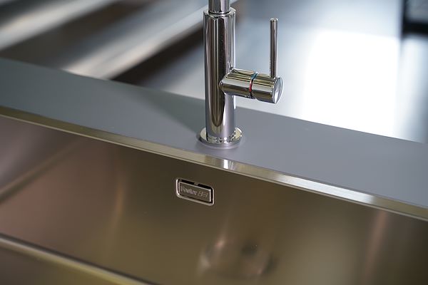 Satin-finish sink bowl with chrome mixer