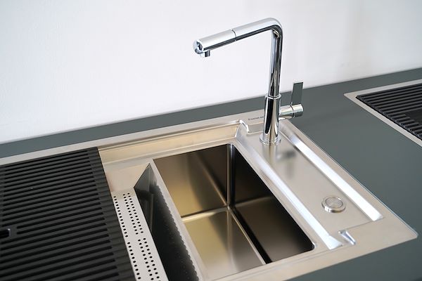 Satin-finish sink with chrome mixer